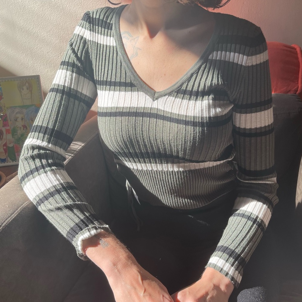 No Boundaries striped v-neck sweate in a 90s style stripe pattern